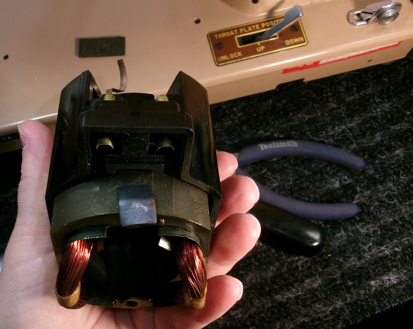 part of a sewing machine motor casing